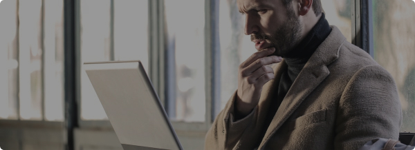 A man watching on laptop